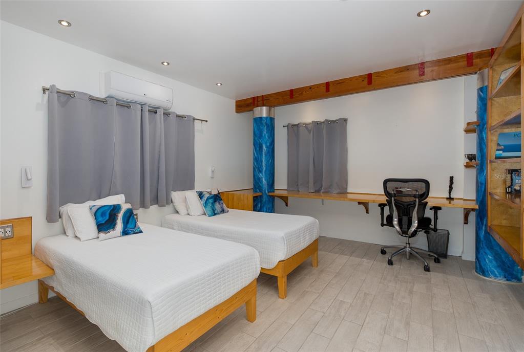 8401 Carolyn Drive Port Richey, FL 34668 - Photo 38 of 66 a bed room with a bed and a chair