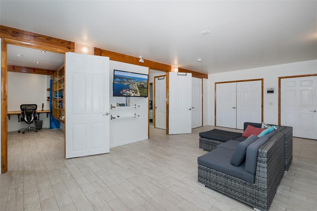 8401 Carolyn Drive Port Richey, FL 34668 - Photo 41 of 66 a living room with furniture and a view of bedroom