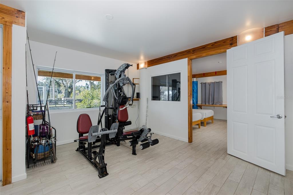 8401 Carolyn Drive Port Richey, FL 34668 - Photo 42 of 66 a view of a room with gym equipment