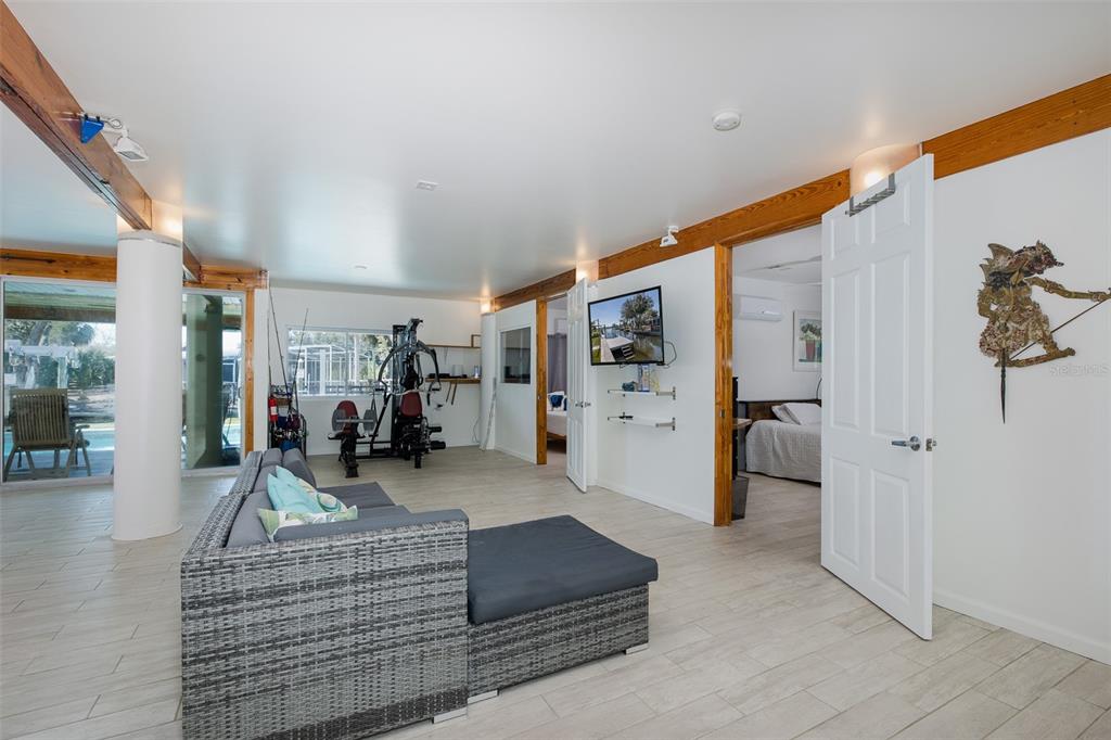 8401 Carolyn Drive Port Richey, FL 34668 - Photo 43 of 66 a living room with furniture and a gym machine