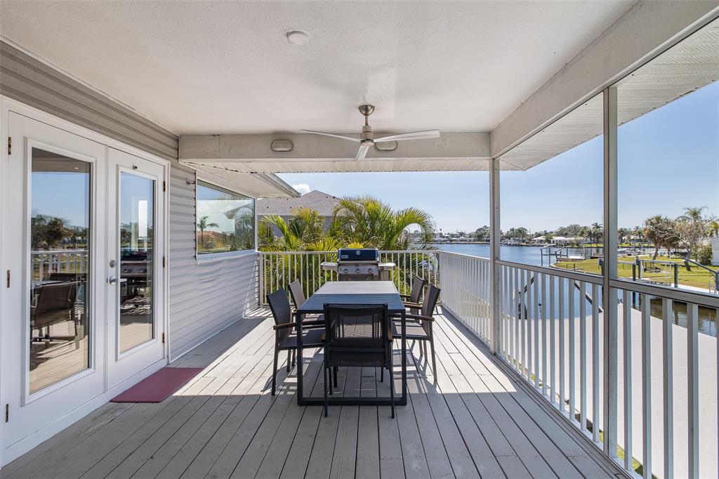 8401 Carolyn Drive Port Richey, FL 34668 - Photo 50 of 66 a view of a balcony with chairs