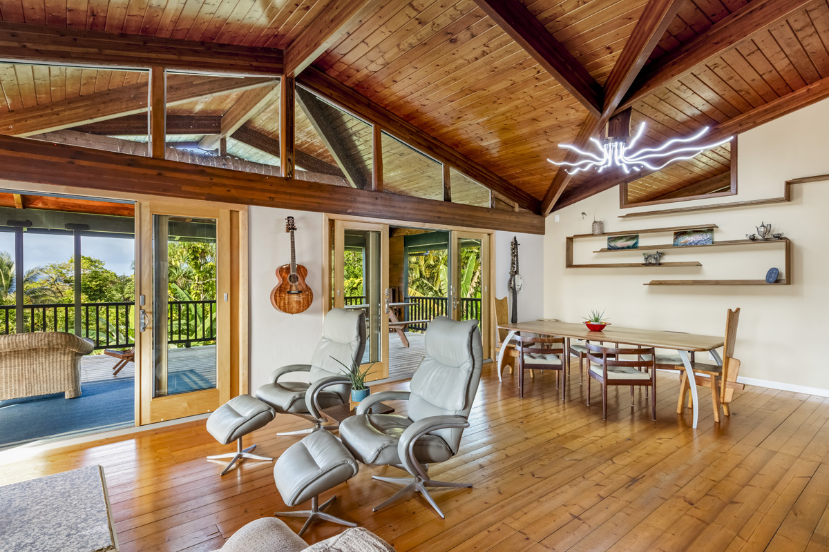 15-2817 Papai Street Pahoa, HI 96778 - Photo 11 of 30 a view of a dining room with furniture wooden floor and chandelier