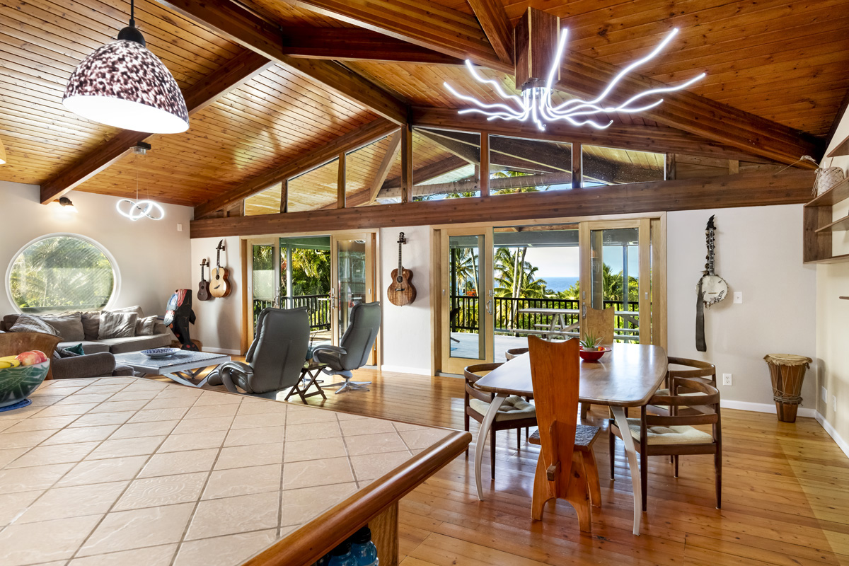 15-2817 Papai Street Pahoa, HI 96778 - Photo 13 of 30 a view of a dining room with furniture wooden floor and chandelier