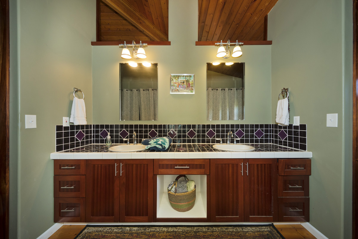 15-2817 Papai Street Pahoa, HI 96778 - Photo 20 of 30 a bathroom with a sink a mirror and a vanity