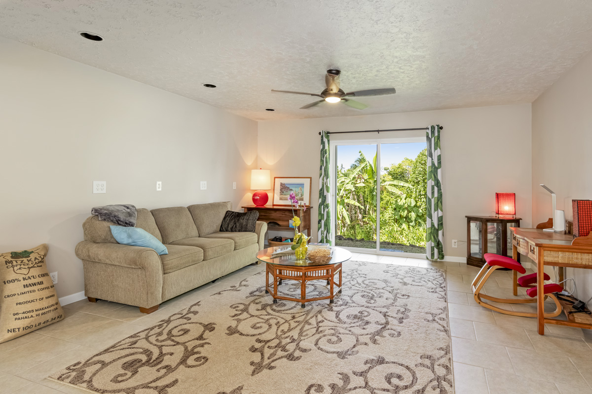 15-2817 Papai Street Pahoa, HI 96778 - Photo 23 of 30 a living room with furniture and a large window
