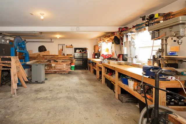 an aerial view of a house with swimming pool outdoor seating and yard