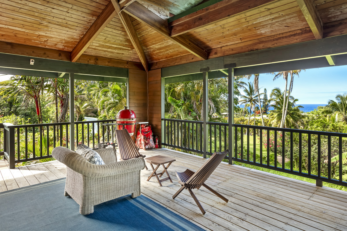 15-2817 Papai Street Pahoa, HI 96778 - Photo 9 of 30 a view of a patio with a table chairs and a patio