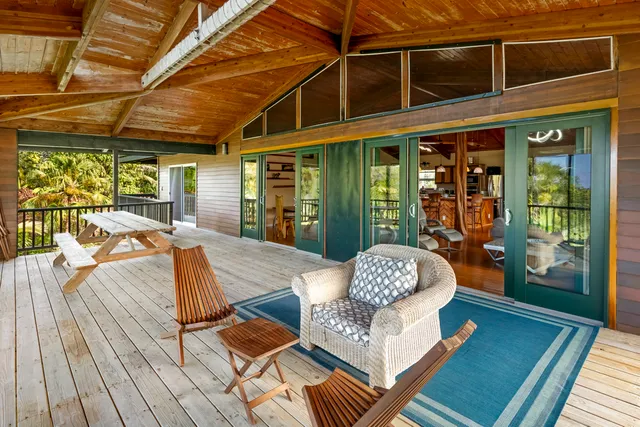 a view of a dining room with furniture wooden floor and chandelier
