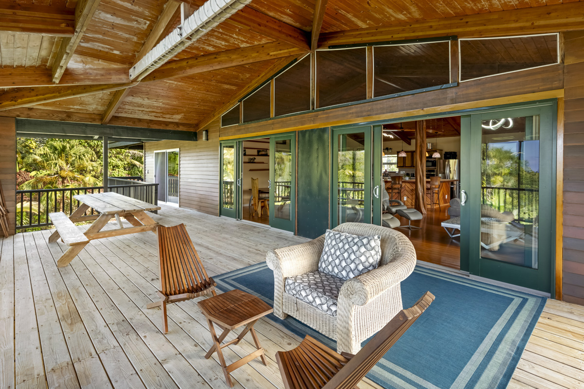 15-2817 Papai Street Pahoa, HI 96778 - Photo 10 of 30 a outdoor space with the couches and dining table with wooden floor