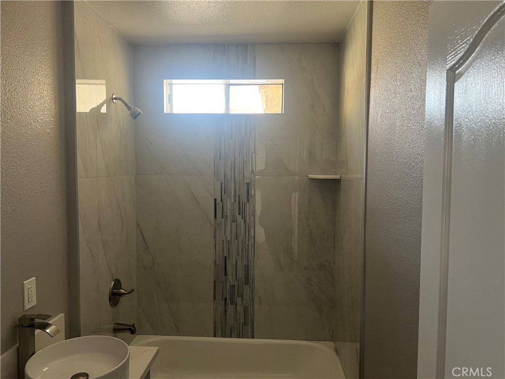 1116 McDonald Avenue Wilmington, CA 90744 - Photo 3 of 3 a bathroom with a toilet and a shower