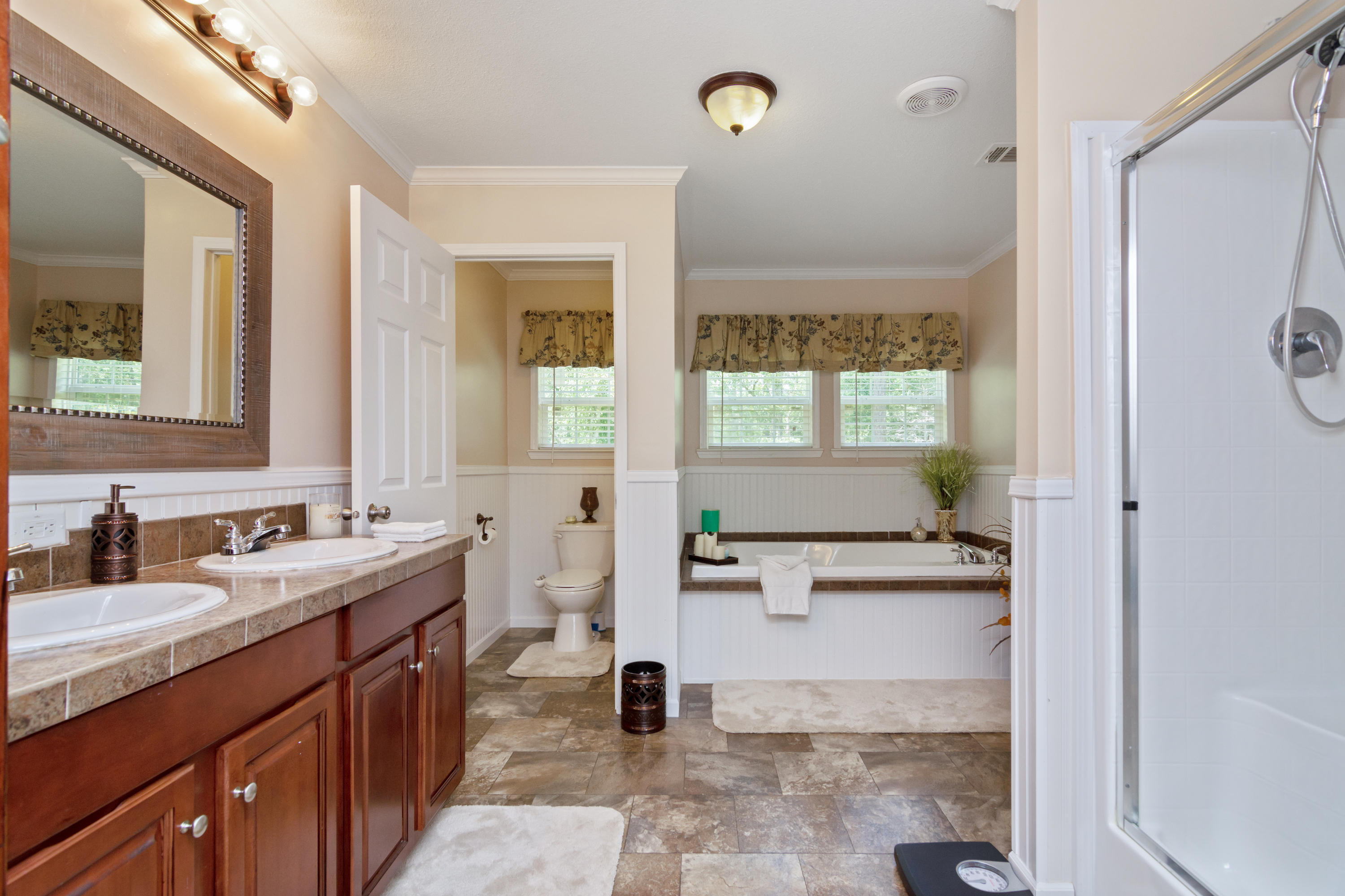 2185 Curtis Madden Road Baker, FL 32531 - Photo 17 of 41 a bathroom with a sink double vanity and a mirror