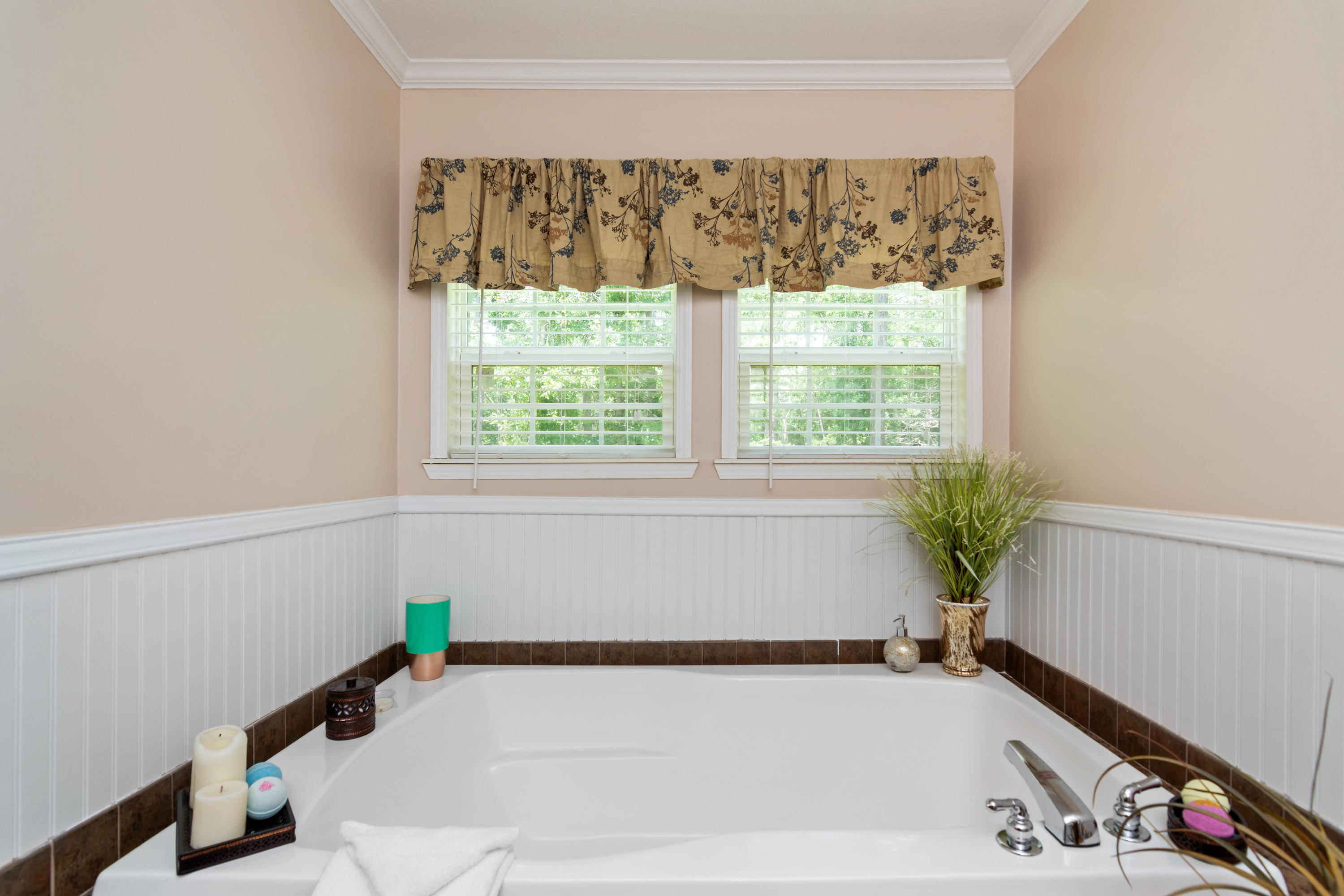 2185 Curtis Madden Road Baker, FL 32531 - Photo 19 of 41 a bathroom with a bathtub and a window
