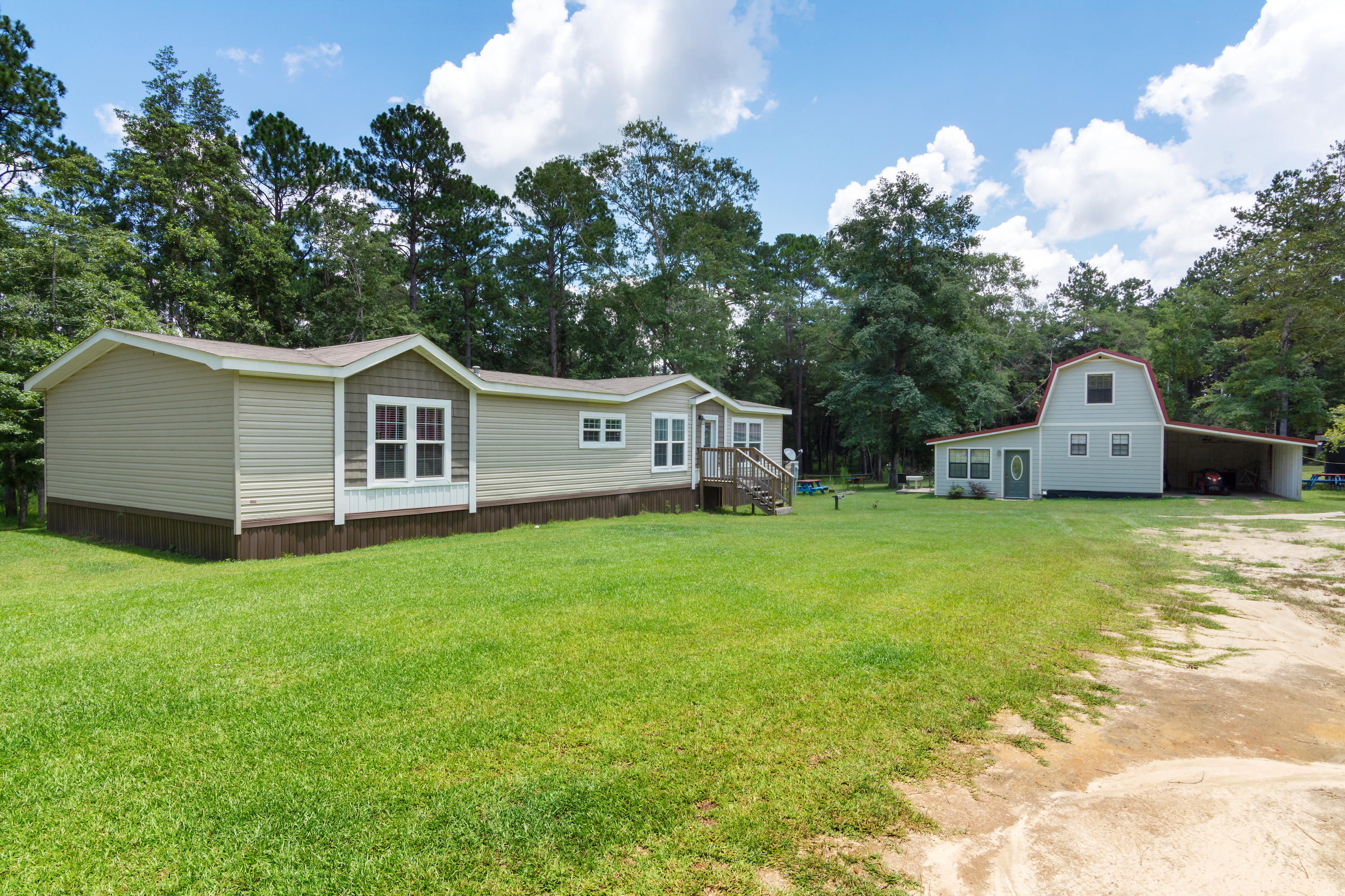 2185 Curtis Madden Road Baker, FL 32531 - Photo 3 of 41 a view of house with backyard and garden