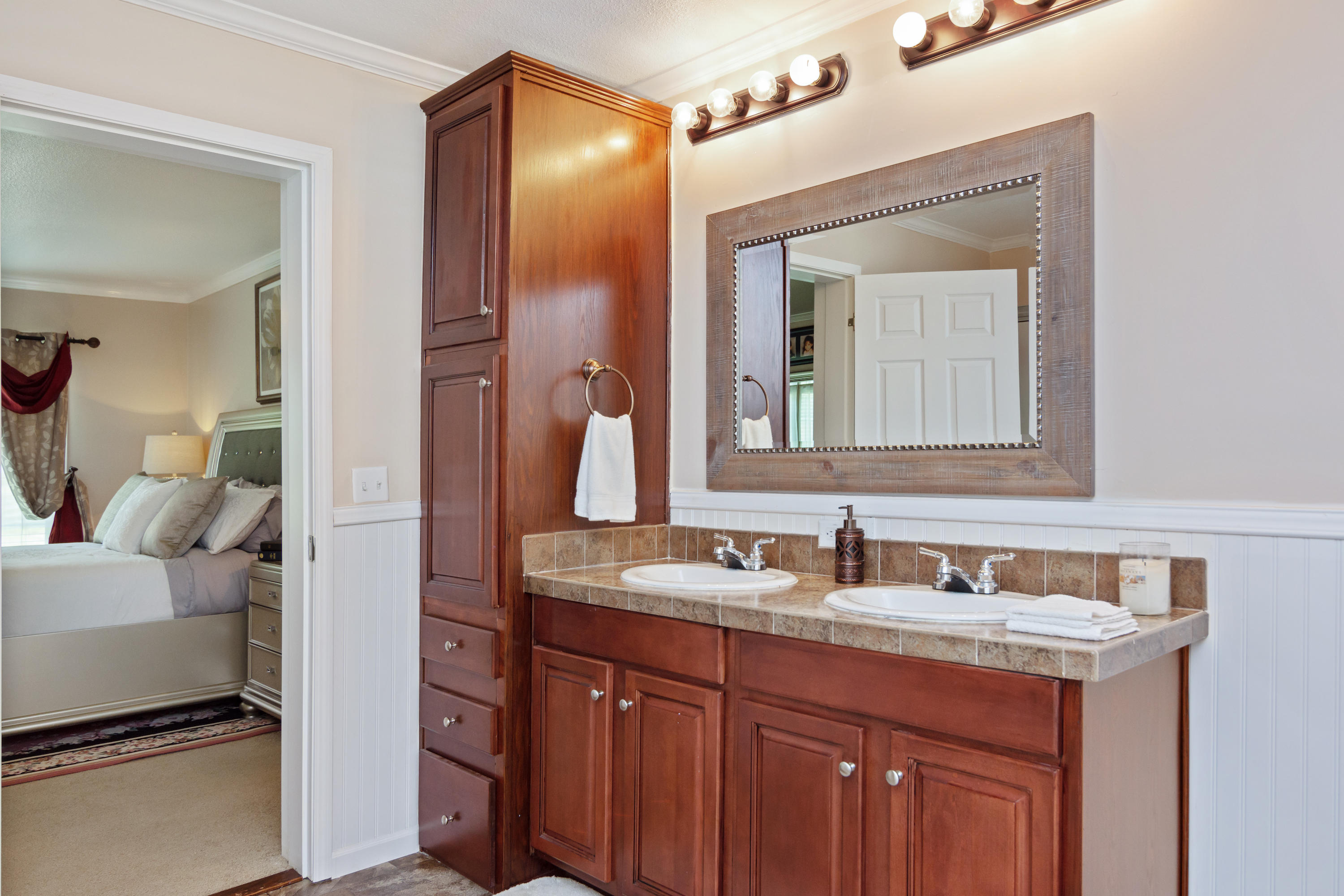 2185 Curtis Madden Road Baker, FL 32531 - Photo 21 of 41 a en suite bathroom with a sink and a mirror