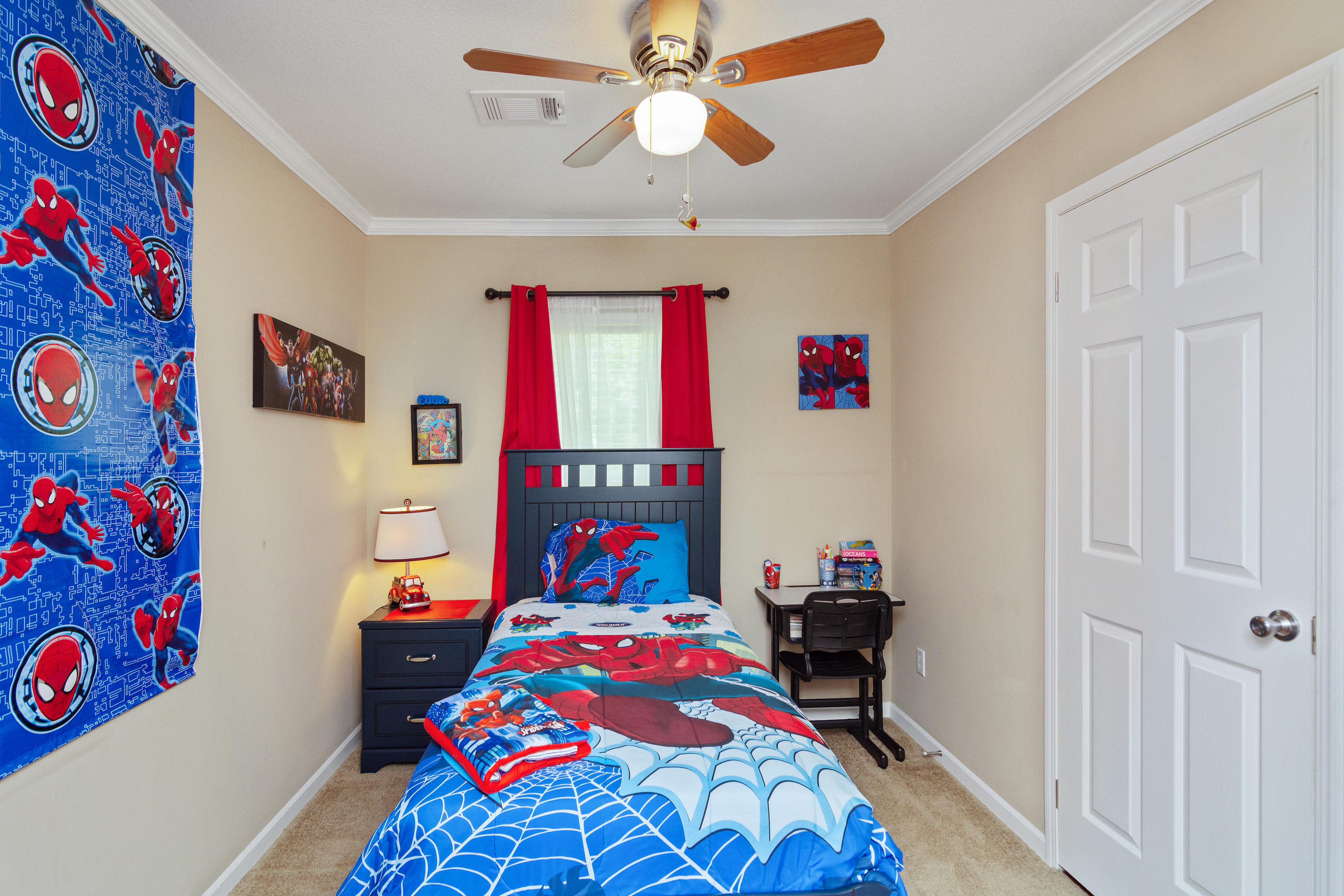 2185 Curtis Madden Road Baker, FL 32531 - Photo 24 of 41 a bedroom with a bed and a chandelier