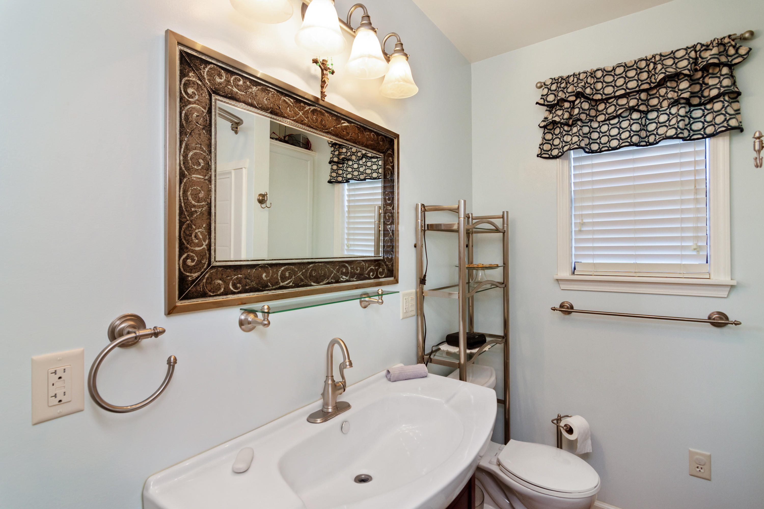 2185 Curtis Madden Road Baker, FL 32531 - Photo 25 of 41 a bathroom with a sink vanity mirror and toilet