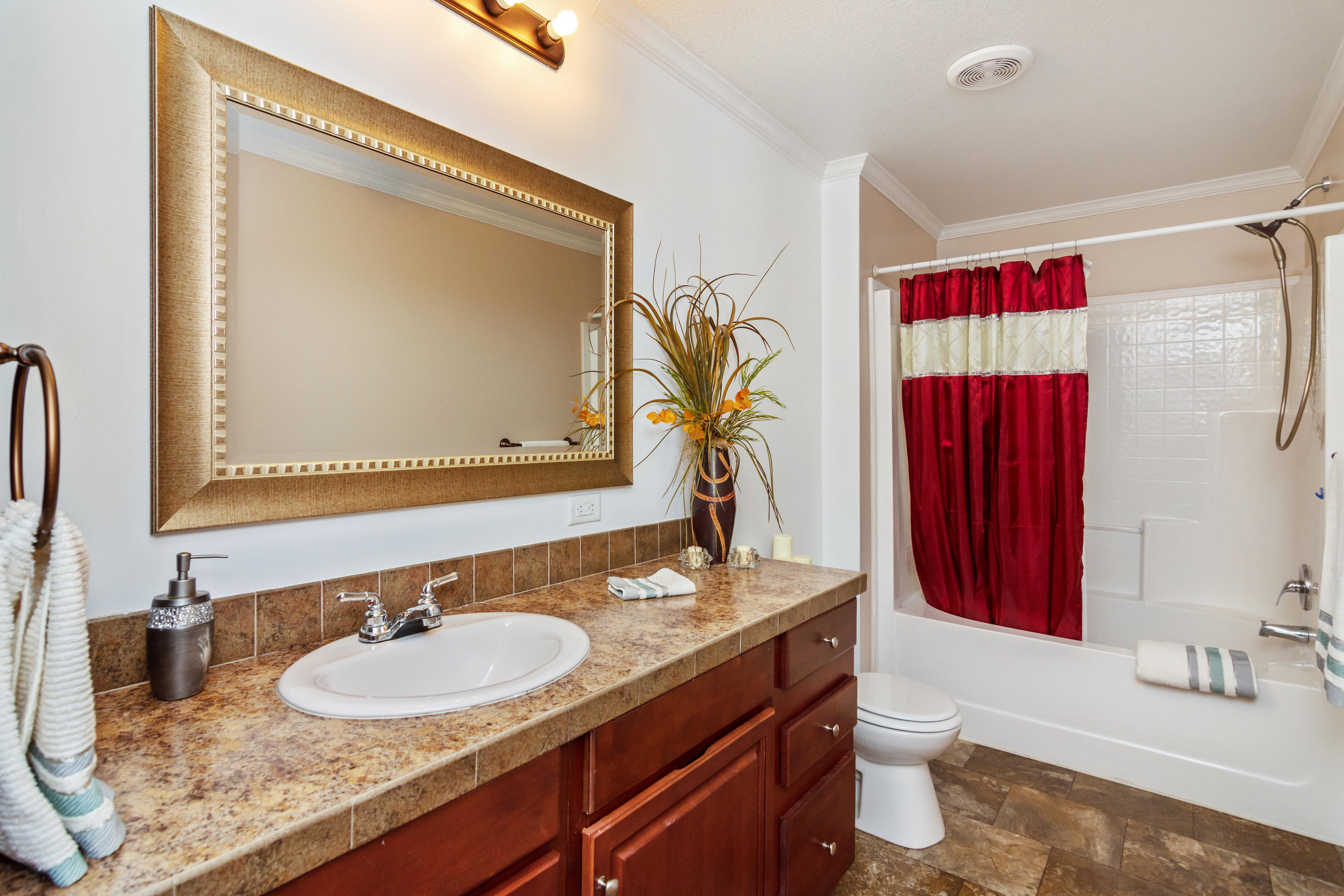 2185 Curtis Madden Road Baker, FL 32531 - Photo 26 of 41 a bathroom with a granite countertop sink and a mirror