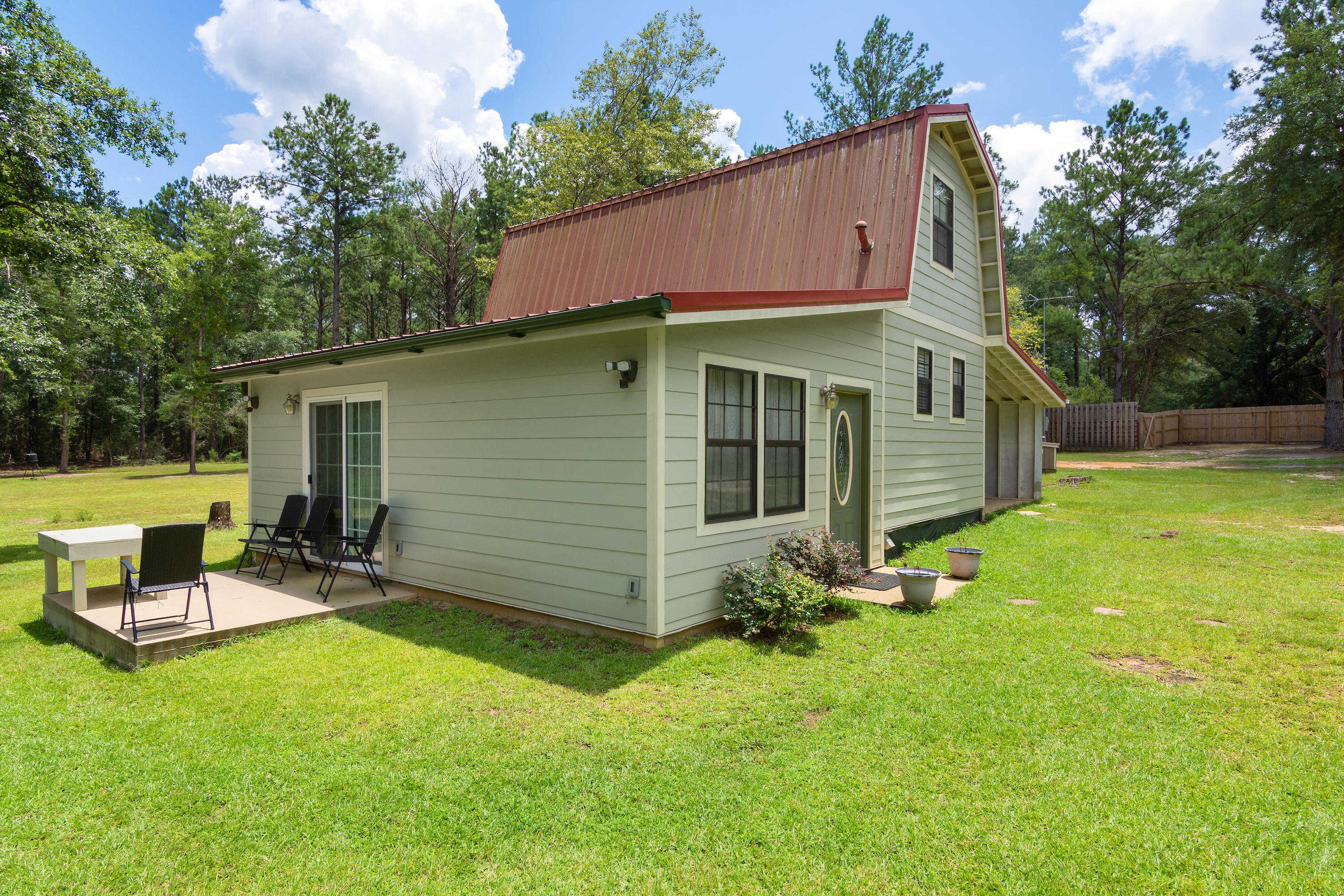 2185 Curtis Madden Road Baker, FL 32531 - Photo 29 of 41 a view of a house with backyard and sitting area