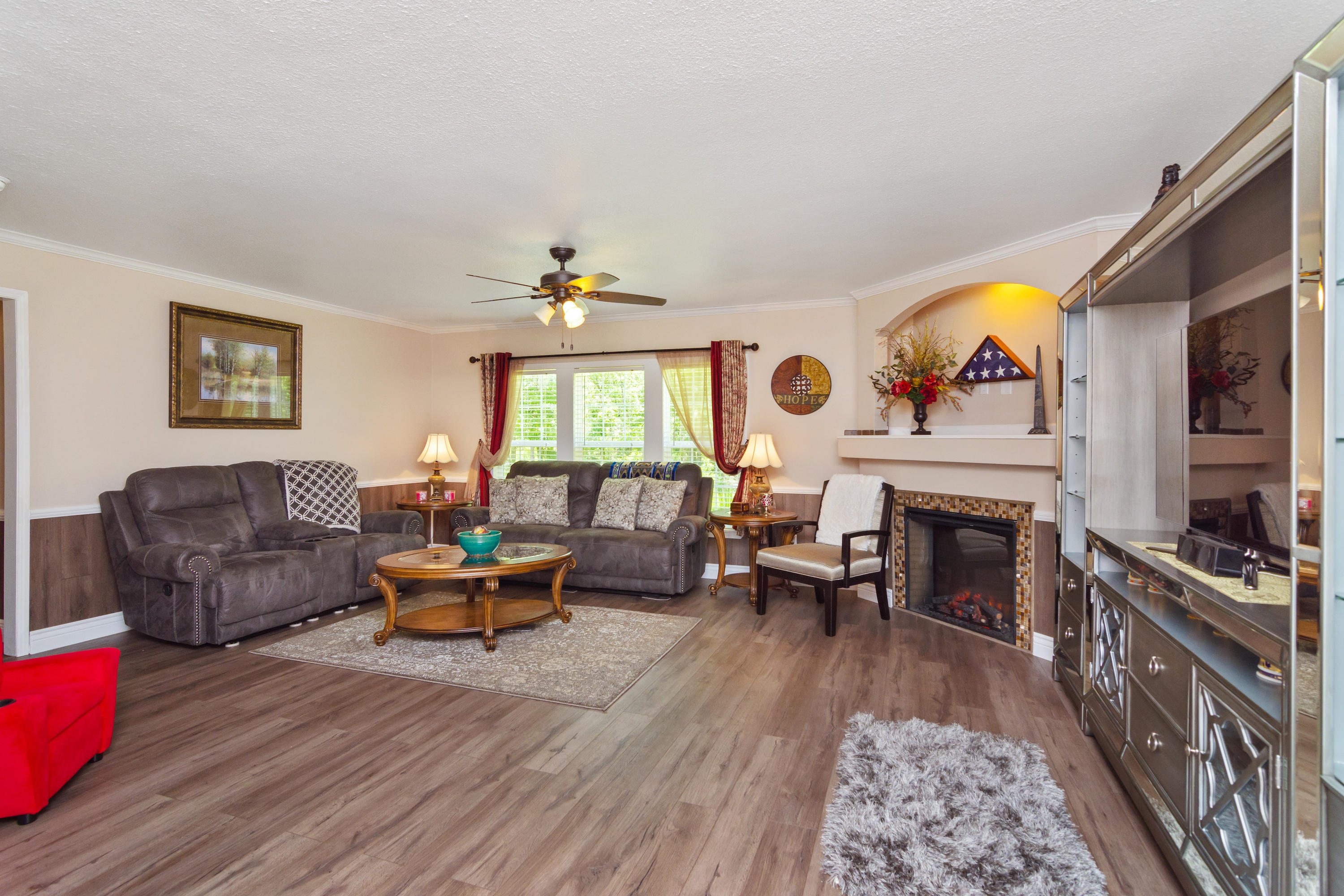 2185 Curtis Madden Road Baker, FL 32531 - Photo 5 of 41 a living room with furniture and a fireplace