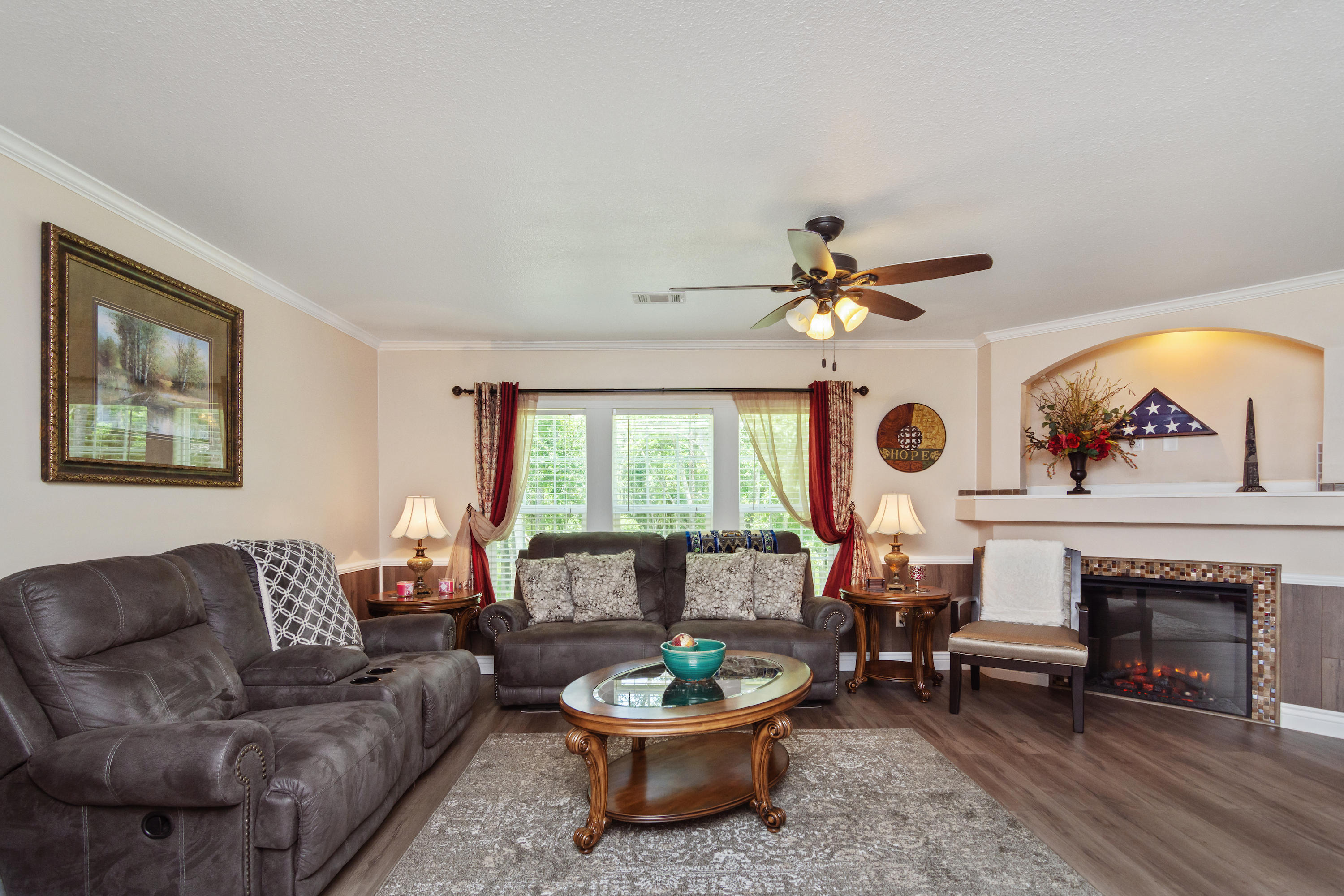 2185 Curtis Madden Road Baker, FL 32531 - Photo 6 of 41 a living room with furniture a window and a fireplace