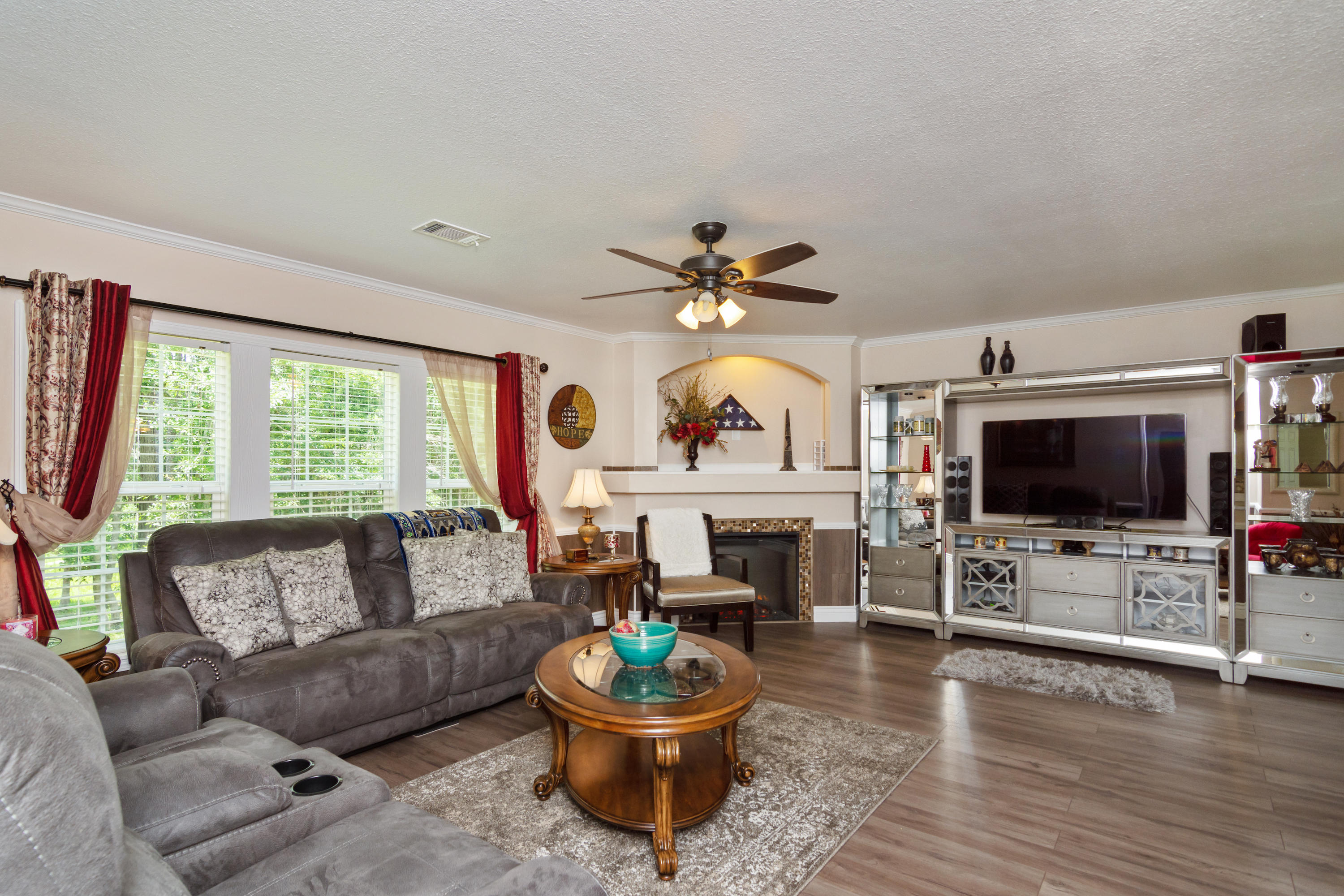 2185 Curtis Madden Road Baker, FL 32531 - Photo 7 of 41 a living room with furniture and a flat screen tv