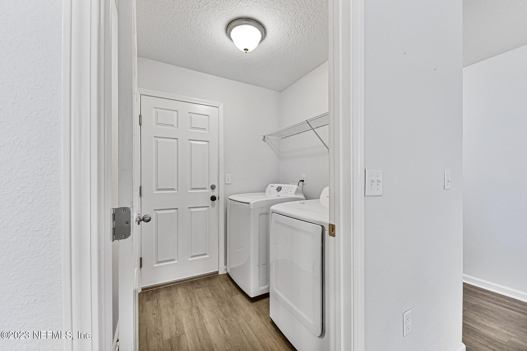 4118 Spring Park Circle Jacksonville, FL 32207 - Photo 12 of 21 a view of a room with wooden floor