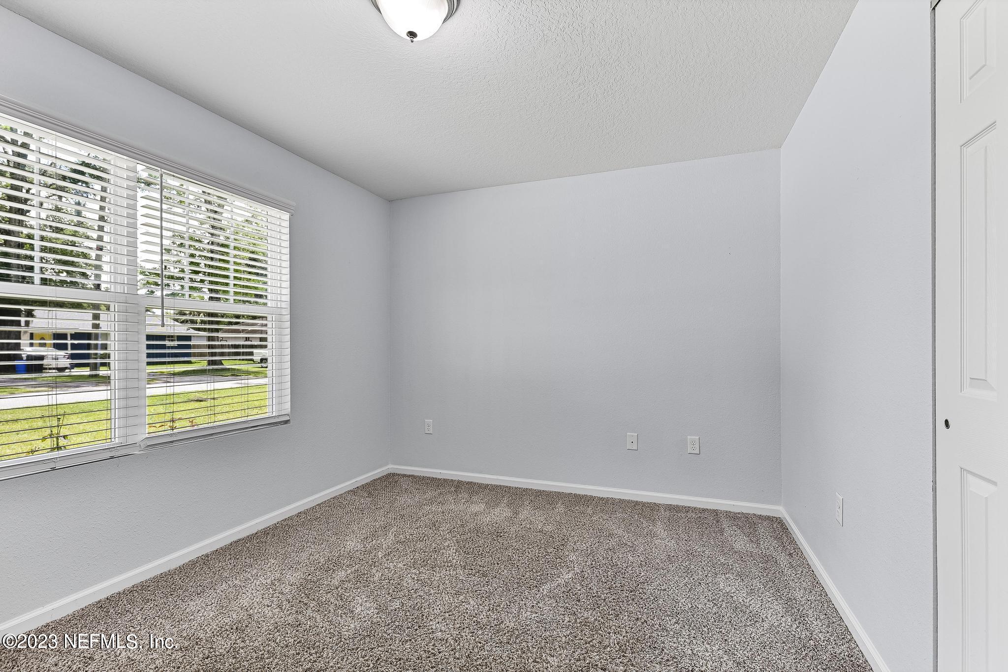 4118 Spring Park Circle Jacksonville, FL 32207 - Photo 18 of 21 an empty room with a window