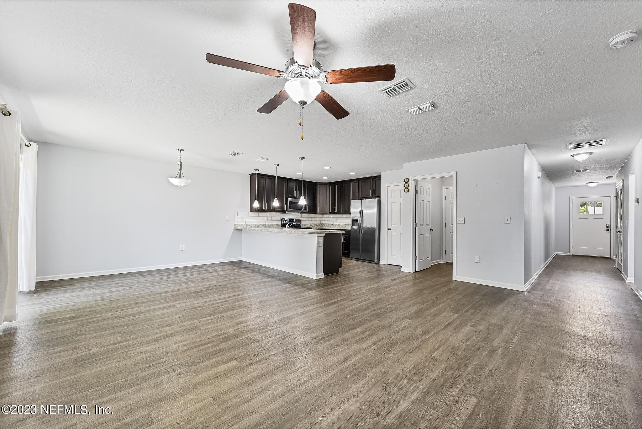 4118 Spring Park Circle Jacksonville, FL 32207 - Photo 6 of 21 a view of a kitchen with a sink wooden floor and a cabinet