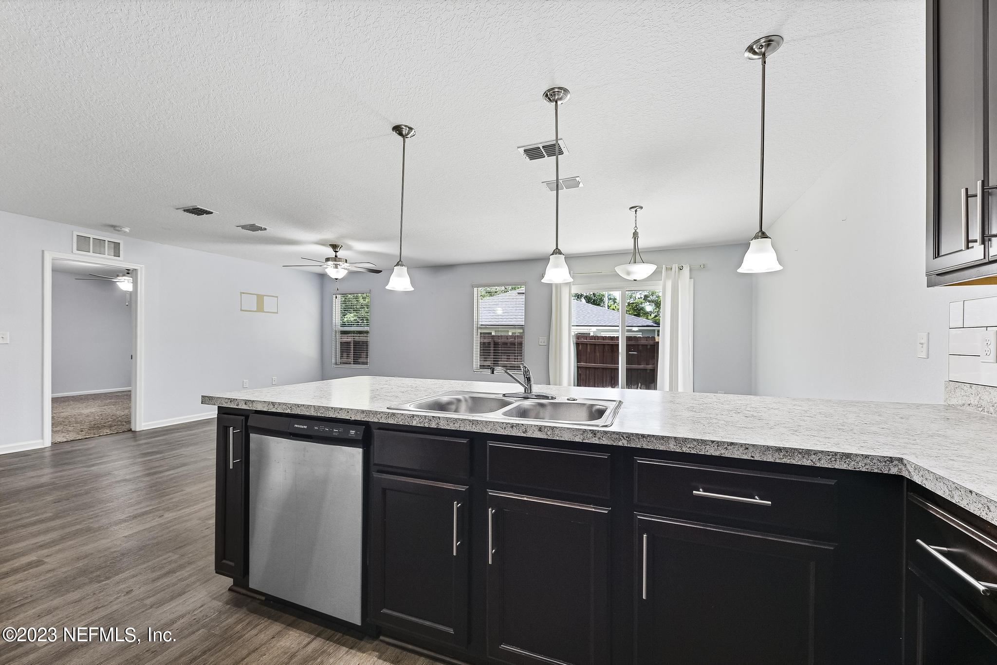 4118 Spring Park Circle Jacksonville, FL 32207 - Photo 10 of 21 a kitchen with a sink and window