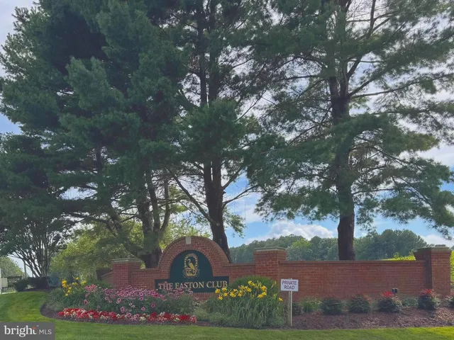 a view of a tree in front of a house