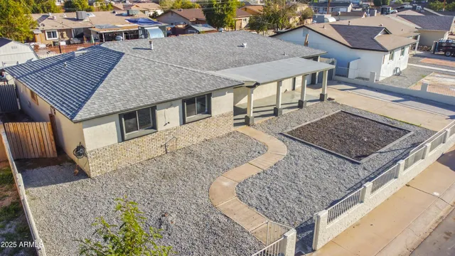 a aerial view of a house with sitting area