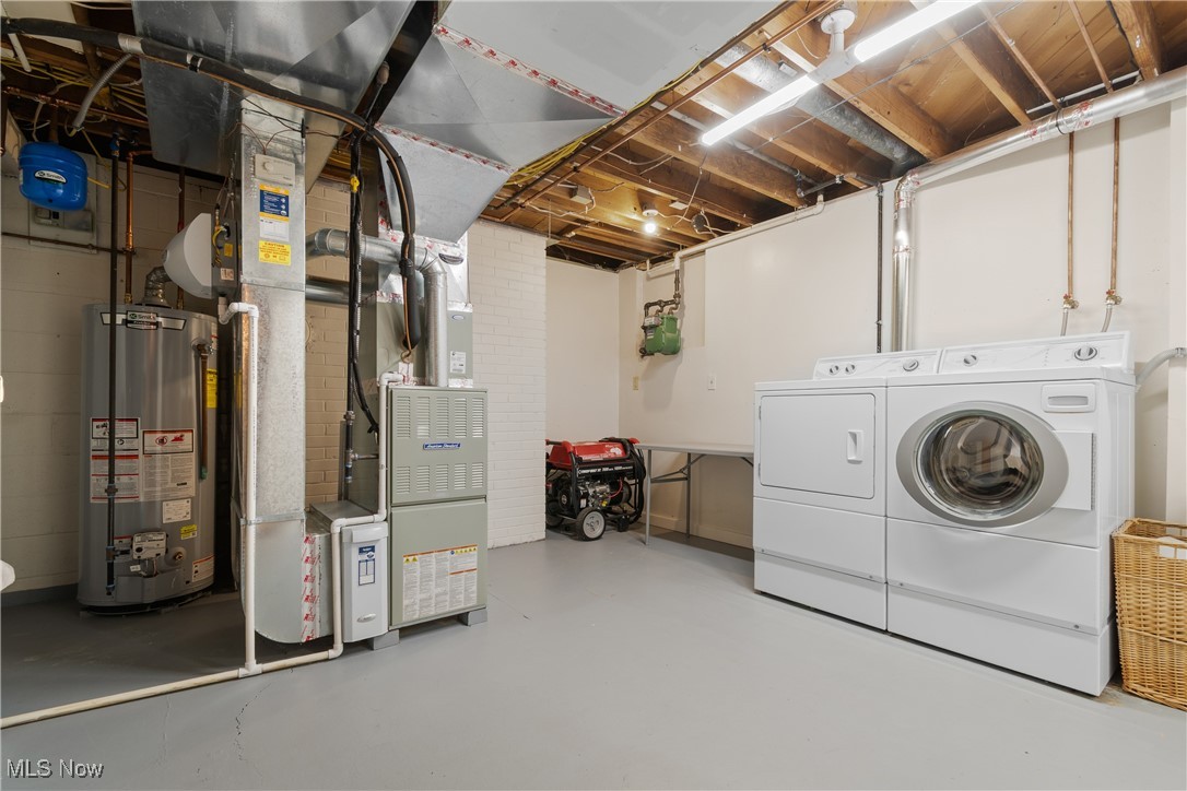 234 Reed Road Wooster, OH 44691 - Photo 29 of 36 Unfinished below grade area with water heater, heating unit, and independent washer and dryer