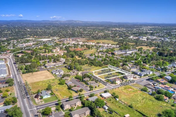 an aerial view of residential building with parking space
