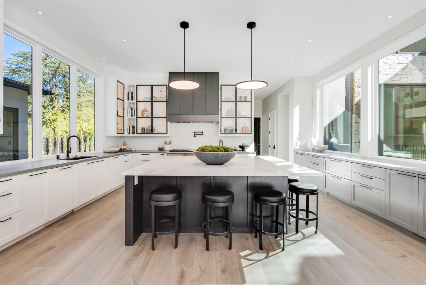 60 Shearer Drive Atherton, CA 94027 - Photo 11 of 39 a kitchen with stainless steel appliances granite countertop a stove a sink a dining table and chairs with wooden floor