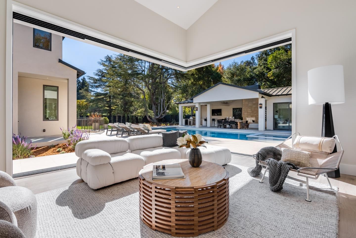 60 Shearer Drive Atherton, CA 94027 - Photo 13 of 39 a living room with furniture a large window and a chandelier