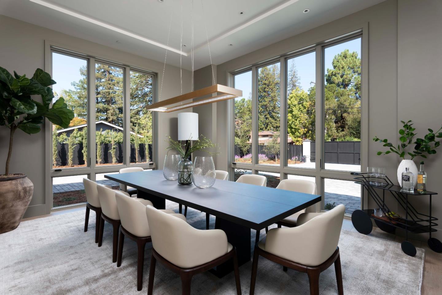 60 Shearer Drive Atherton, CA 94027 - Photo 6 of 39 a dining room with furniture wooden floor and a potted plant