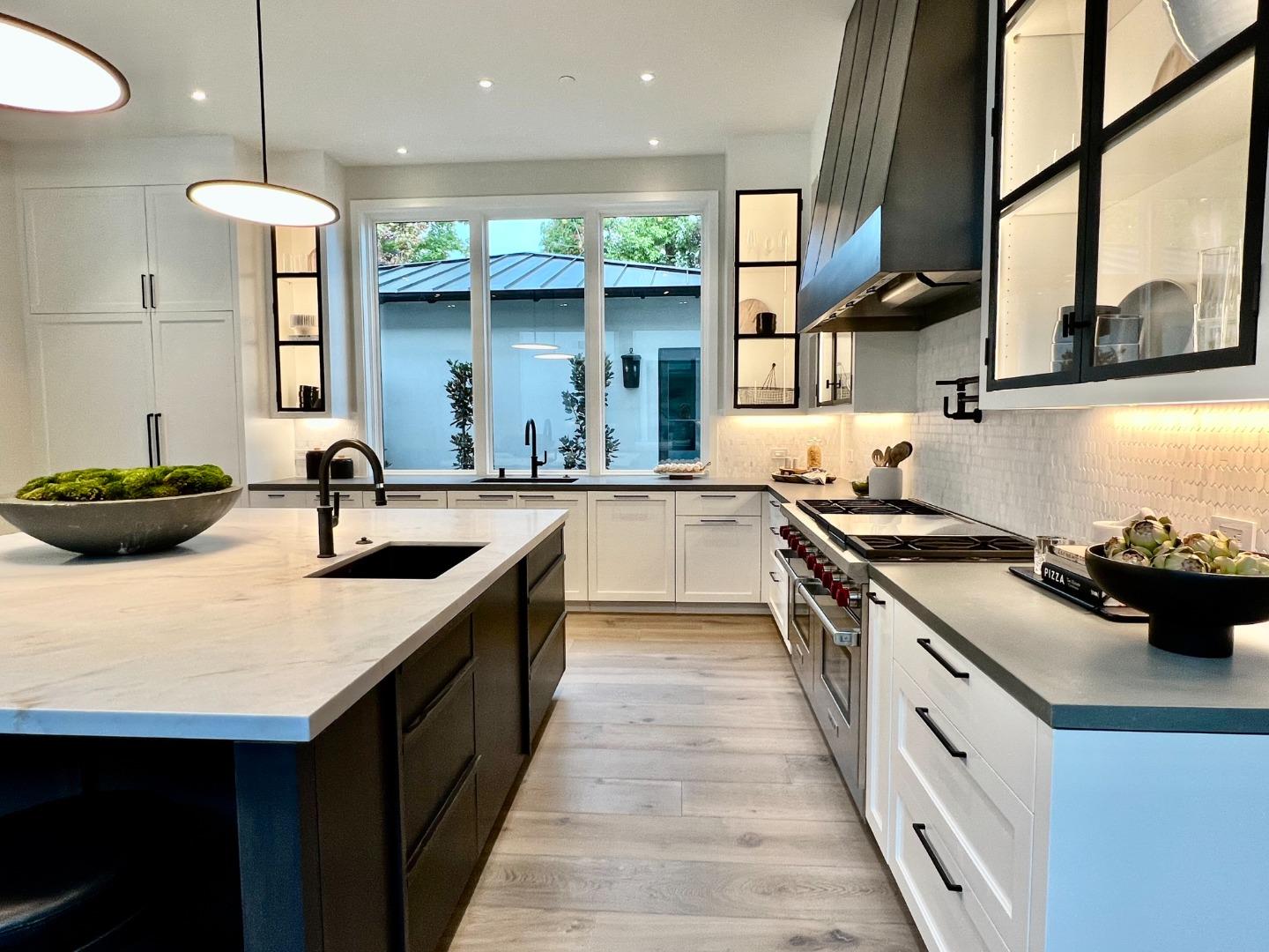 60 Shearer Drive Atherton, CA 94027 - Photo 9 of 39 a kitchen with stainless steel appliances a sink a stove and a wooden floor
