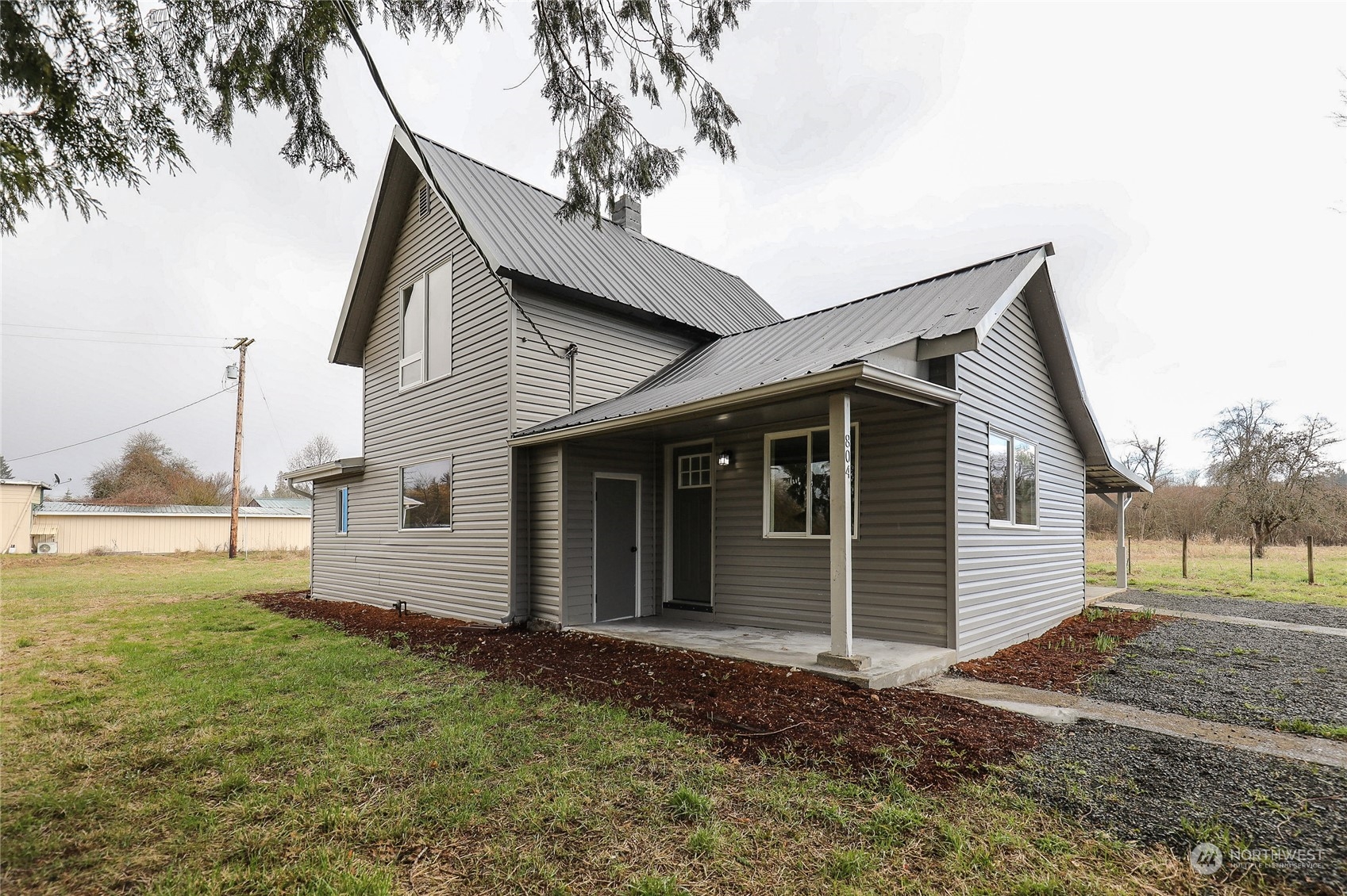a view of a house with a yard