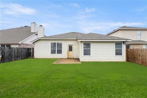 a view of a backyard with a garden