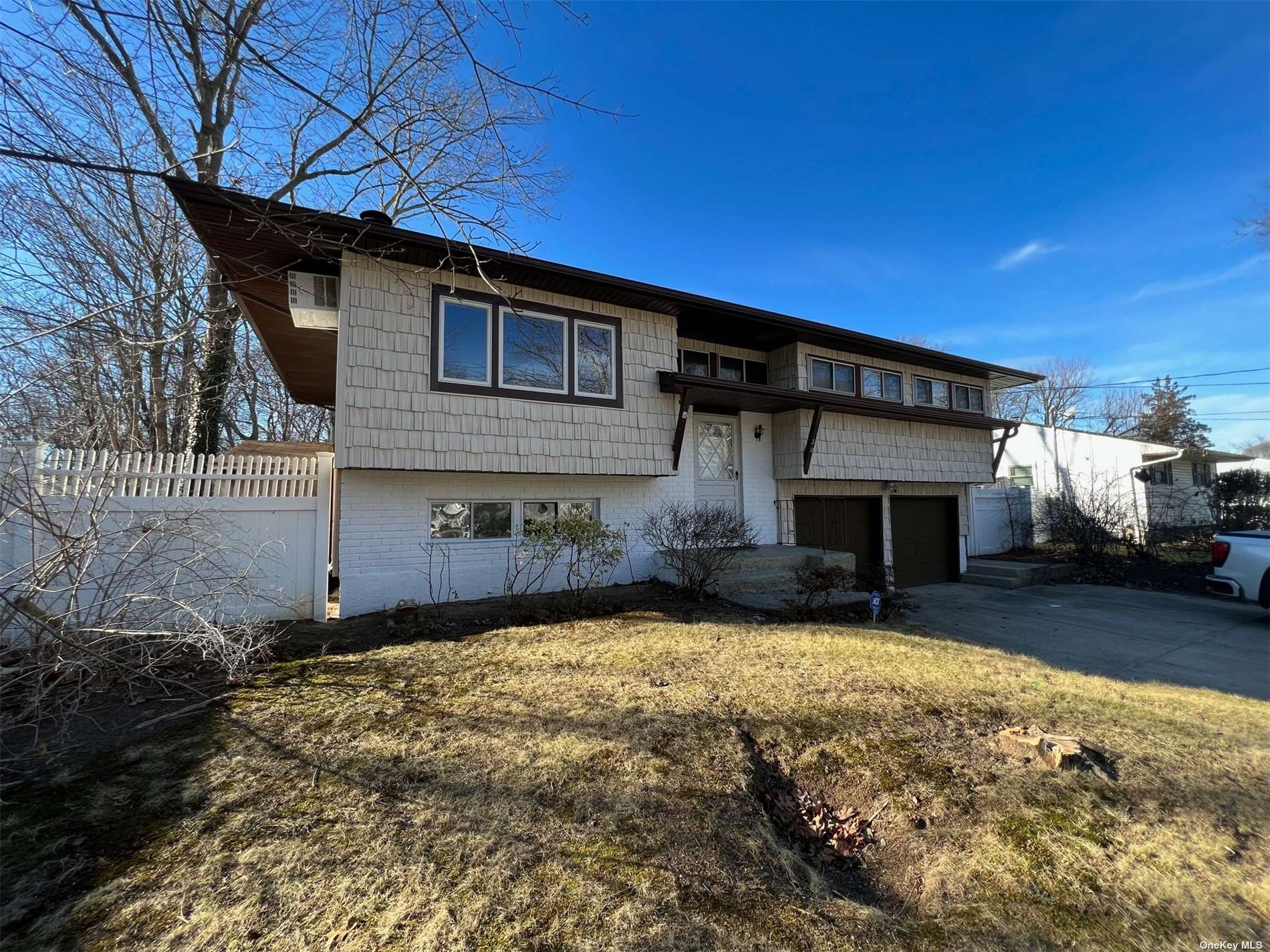 30 Holbrook Road Centereach, NY 11720 - Photo 1 of 1 a view of a house with a yard