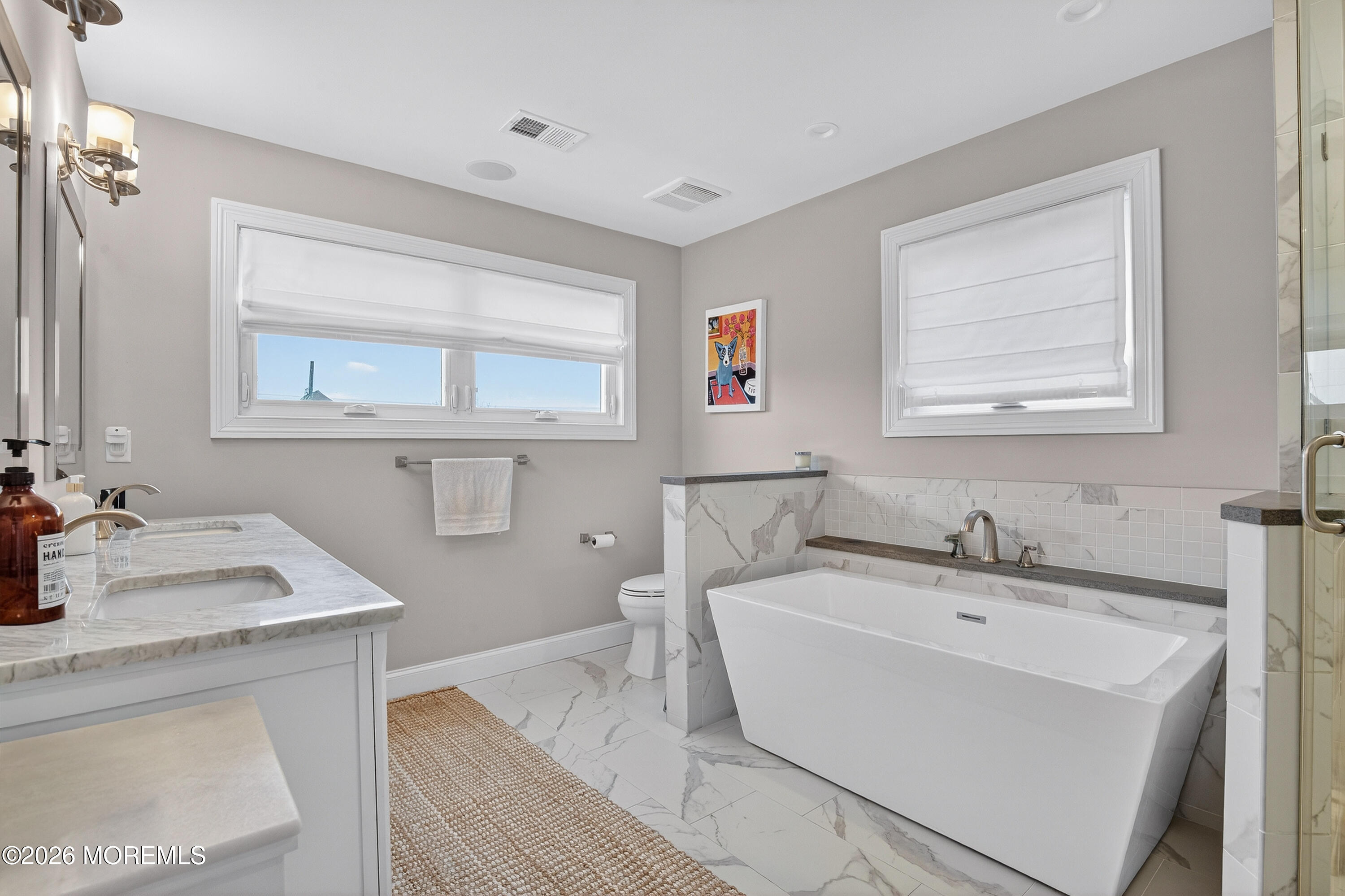 27 5th Street Highlands, NJ 07732 - Photo 18 of 62 a bathroom with a sink and a mirror