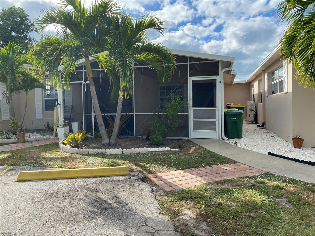 2084 Monroe Avenue Naples, FL 34112 - Photo 2 of 10 a view of a backyard with a patio