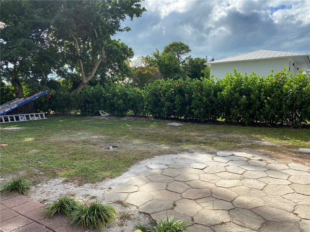 2084 Monroe Avenue Naples, FL 34112 - Photo 4 of 10 a view of a patio with a yard