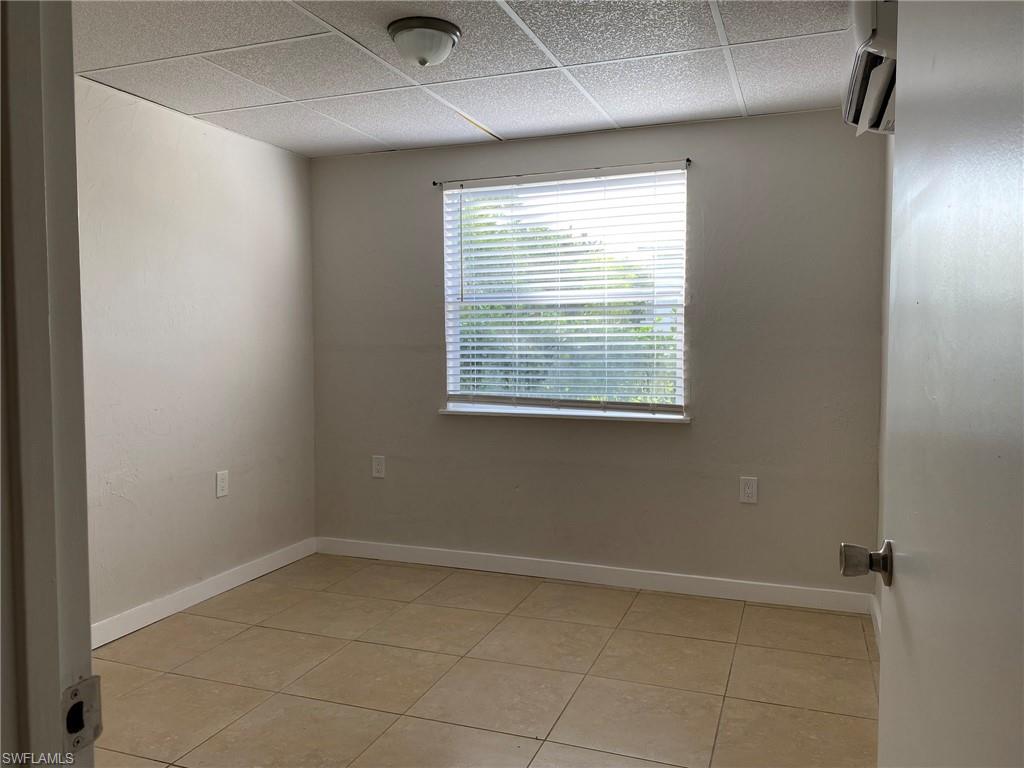 2084 Monroe Avenue Naples, FL 34112 - Photo 7 of 10 a view of an empty room with a window