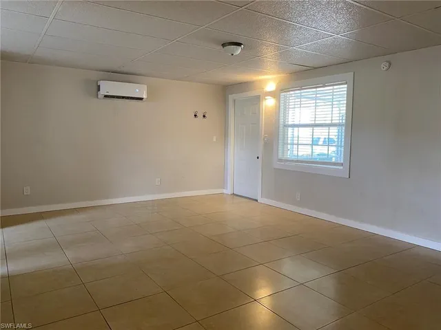 a view of an empty room with a window
