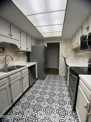 a living room with furniture a gym equipment and a rug