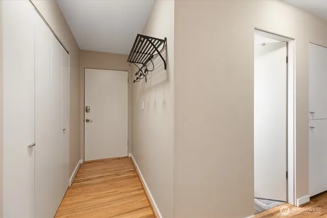 a view of a room with wooden floor