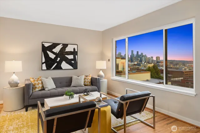 a living room with furniture and a large window