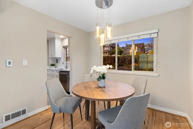 a dining room with furniture and window