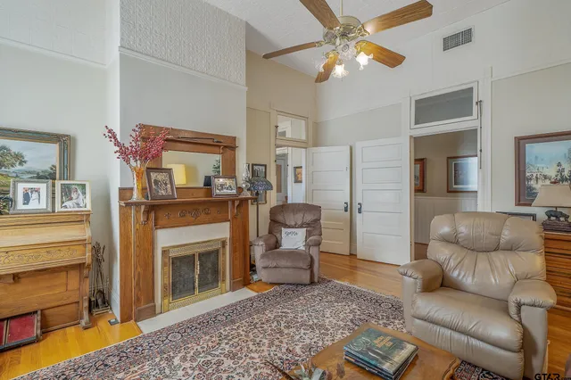 a living room with furniture and a fireplace